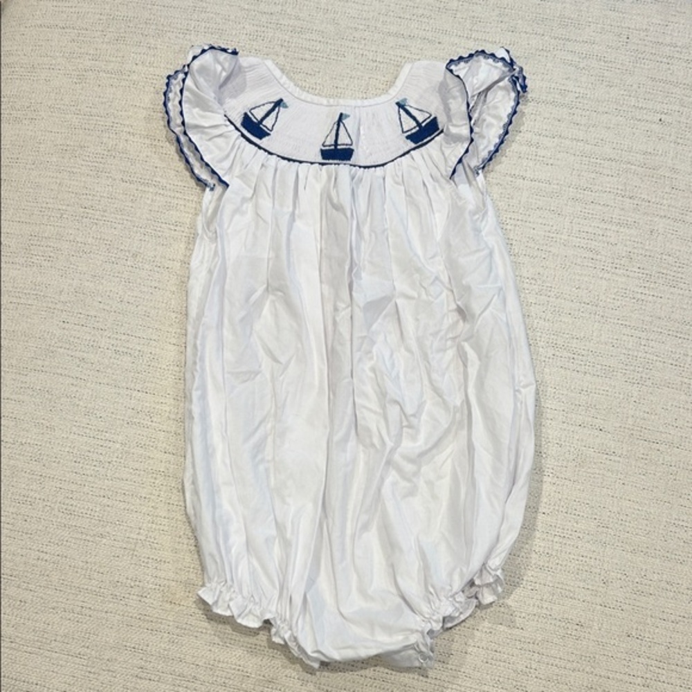 White Smocked Bubble Romper with Blue Sailboat Design